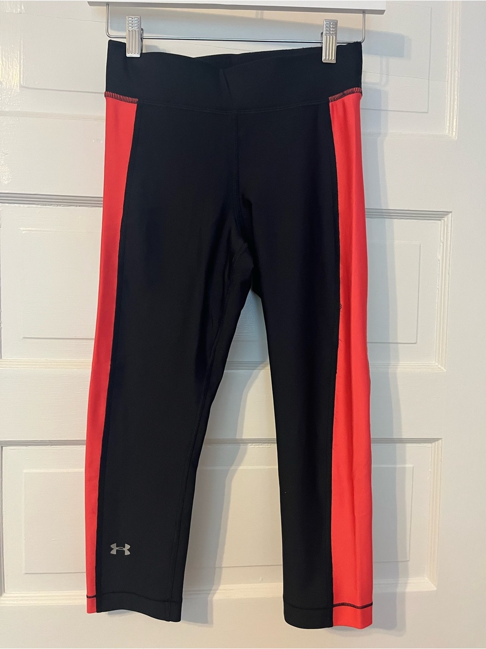 Under Armour compressing leggings- Black with Orange Interior and Logo